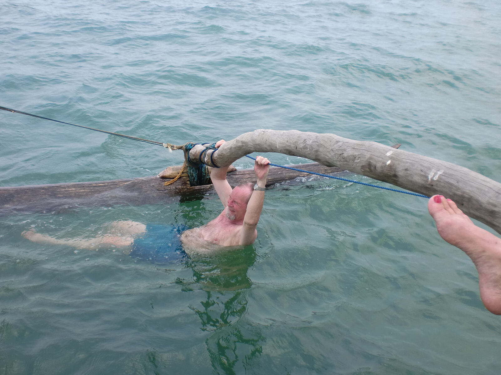 Swimming beside an outrigger