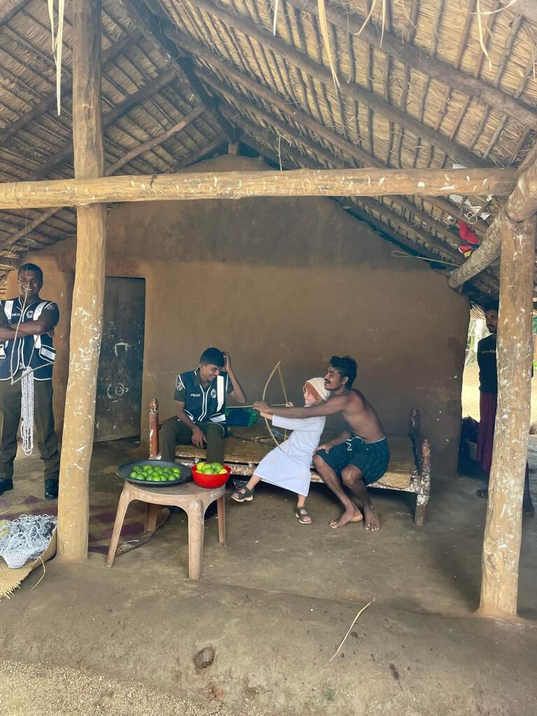 An archery demonstration at a village hut